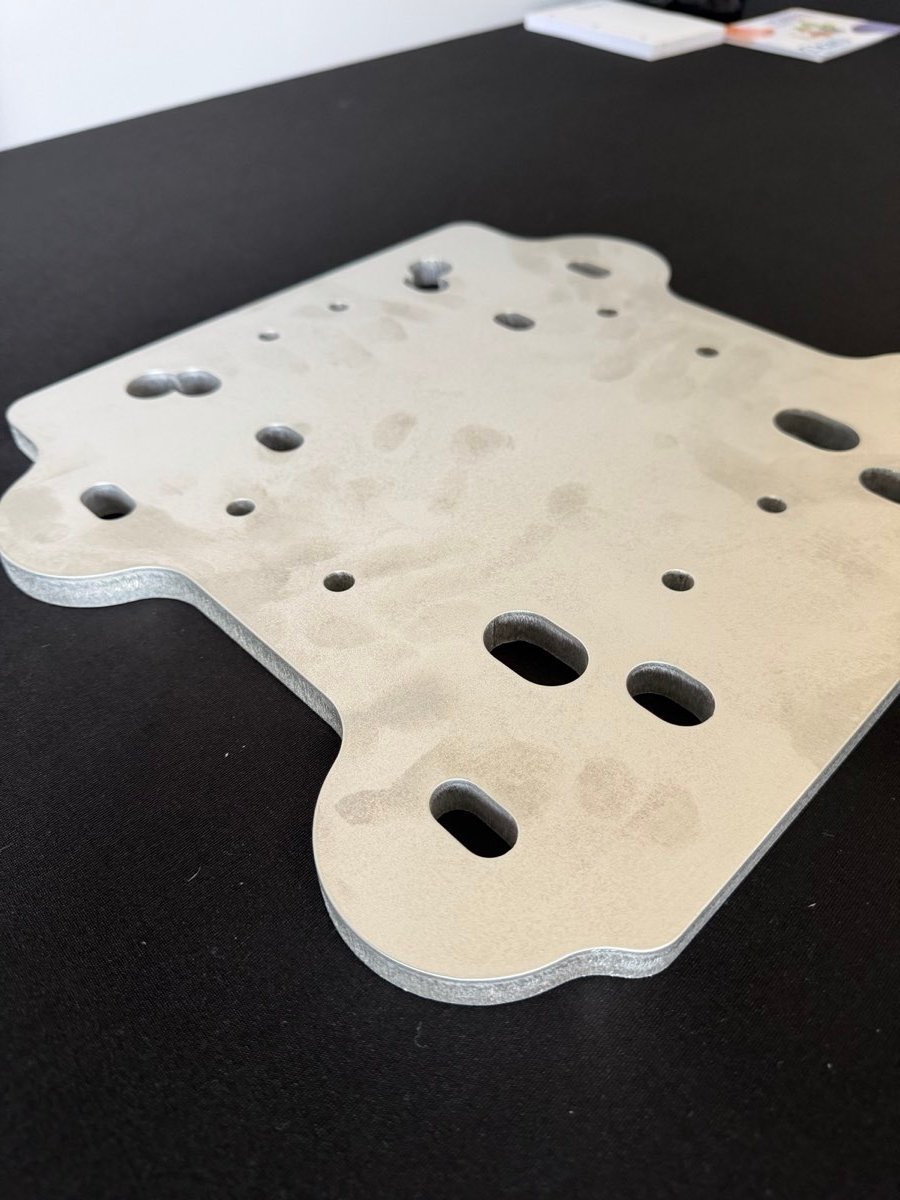 Precision-cut aluminum mounting plate with slots and holes
